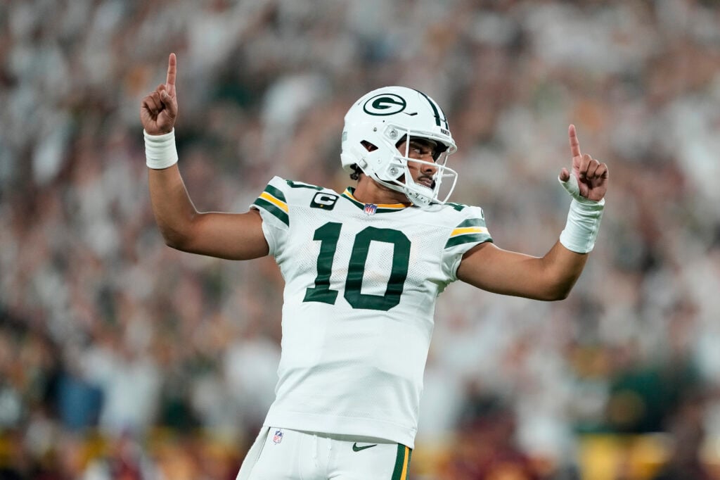 GREEN BAY, WISCONSIN - SEPTEMBER 11: Jordan Love #10 of the Green Bay Packers celebrates after Josh Jacobs #8 scored a touchdown against the Washington Commanders during the second quarter in the game at Lambeau Field on September 11, 2025 in Green Bay, Wisconsin.