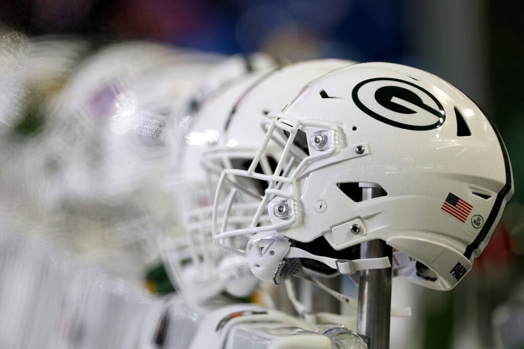 SEATTLE, WASHINGTON - DECEMBER 15: A detail view of Green Bay Packers football helmets before the game Seahawks at Lumen Field on December 15, 2024 in Seattle, Washington.