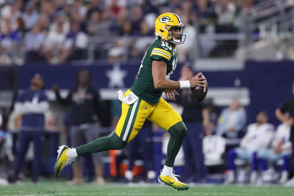 ARLINGTON, TEXAS - SEPTEMBER 28: Jordan Love #10 of the Green Bay Packers scrambles against the Dallas Cowboys during the first half in the game at AT&T Stadium on September 28, 2025 in Arlington, Texas.